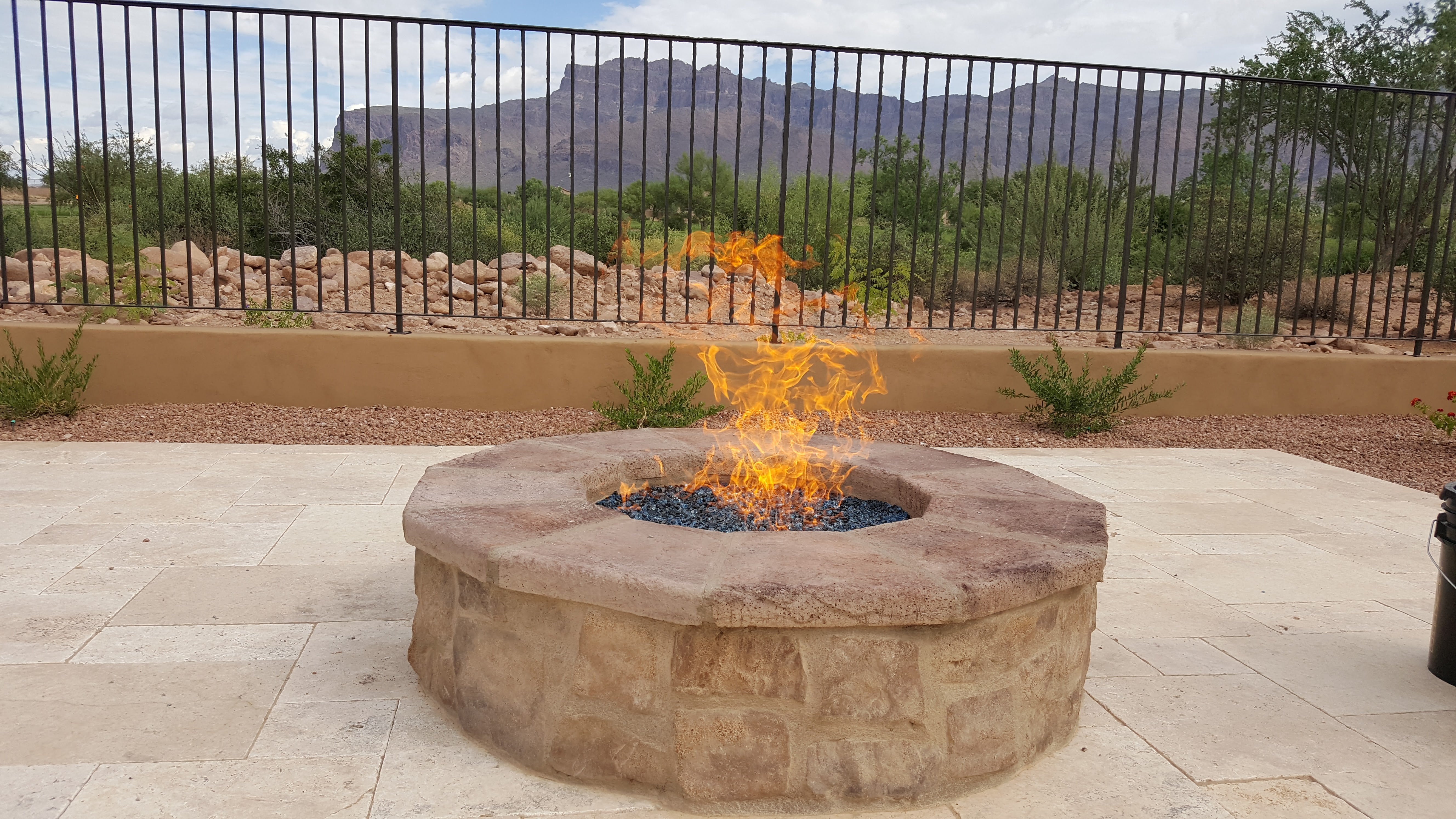 FAQs About Fire Features - Round Masonry Fire Pit with Fire Glass