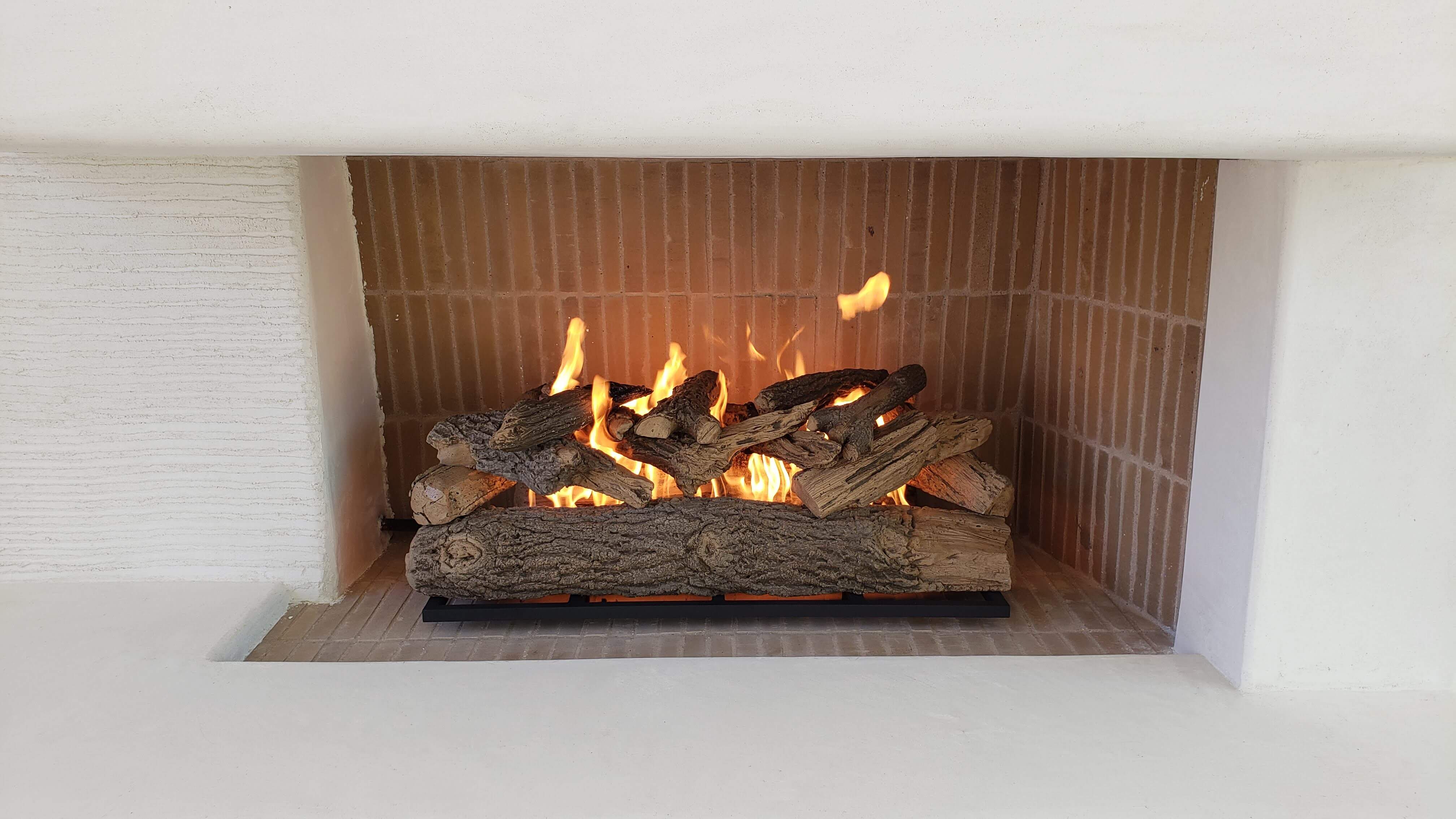 The Best Wood and Fuel Types for Your Fire Feature - Floating Log Set Grate & Burner by Eric Tolbert