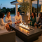 Fire Tables: Functional Furniture Meets Flames - friends gathered around a fire table with drinks socializing