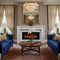 Electric Fireplaces: Plug In, Chill Out, Look Cool -  Electric fireplace inside a posh family room with lavish furniture
