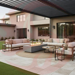 Fire Table Furniture Sets: Ignite Your Patio Game - fire table furniture set on travertine in a residential backyard underneath a pergola with a nice beige stucco home in the background and artificial turf around the travertine