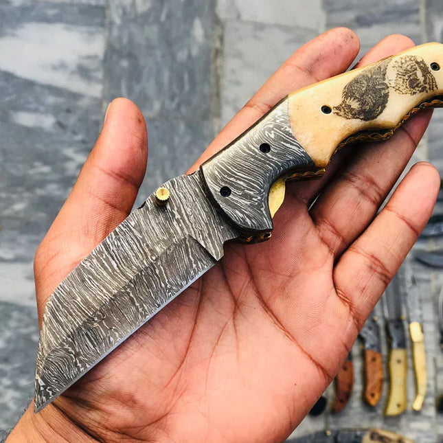 Custom Handmade Damascus Steel Engraved Folding Pocket Knife with Hand Engraved Bone Handle and Leather Case by KBS Knives Store.